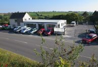 Image for: Investment Premises comprising a Car Showroom which is vacant, plus range of Garage and Workshops plus 2 One Bedroom Flats